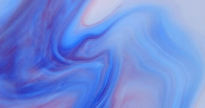 Moving marble texture background. Fluid art of flowing red, blue and yellow colors on a white background.
