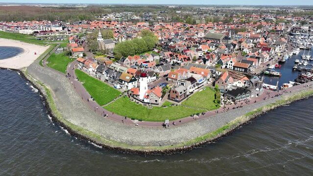 Boulevard and coastline of Urk in the netherlands. also the lighthouse of urk can be seen