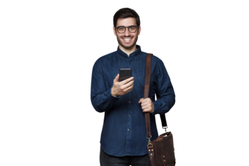 Businessman in casual denim shirt, wearing bag on shoulder and holding phone with excited face