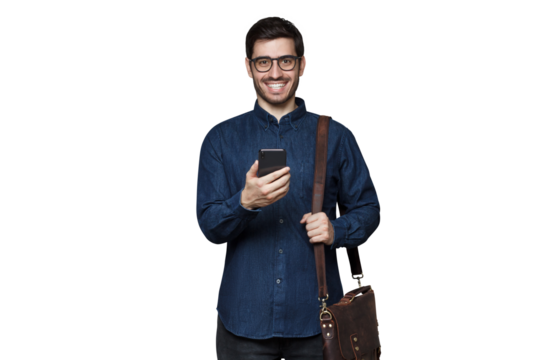 Businessman in casual denim shirt, wearing bag on shoulder and holding phone with excited face