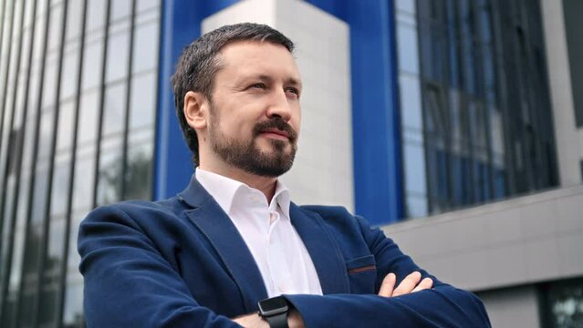 Smiling ambitious business man leader boss satisfaction proud face downtown outdoor closeup