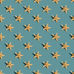 Starfish on green background with shadows. Seamless pattern, summer vacation banner concept