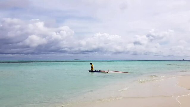 Gorgeous view of white boat on endless ocean merging with blue sky background. Maldive islands. Time Lasse.