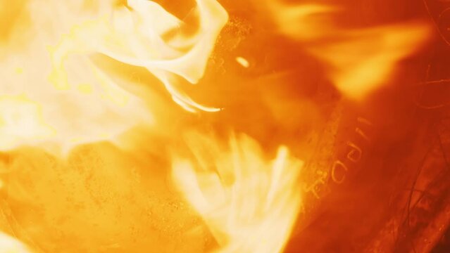 Burning car wheel, tire disk on fire close up. Furious flame all over the screen. Dynamic tire burning. Car accident, burning body vehicle. Detonated transport