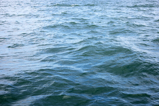 Blue sea water surface texture. Blue ocean summer © Bowonpat