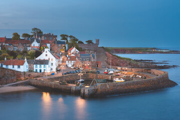 Scenic, picturesque twilight view of the charming coastal fishing village of Crail and its harbour in East Neuk, Fife, Scotland, UK.