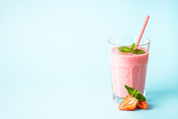 Strawberry smoothie or milkshake at blue.