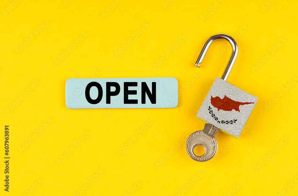 Poster On the yellow surface is an open lock with a key and a sticker with the inscription - open