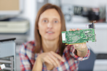 female worker showing a hard drive