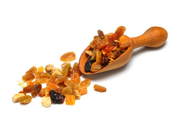 Mix of nuts and dried fruits in wooden spoon isolated on a white background. 