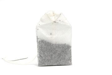   dry tea bag on a white background. One rectangular tea bag closeup. Herbal and black tea bags.