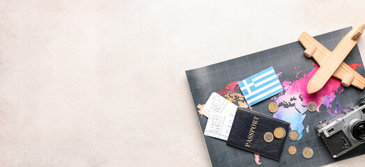 Greek flag, world map, passport, tickets, photo camera and wooden airplane on light background with space for text