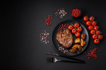 Delicious juicy pork or beef steak grilled with salt, spices and herbs