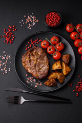 Delicious juicy pork or beef steak grilled with salt, spices and herbs