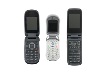 Three old flip cell phones isolated with cut out background.  