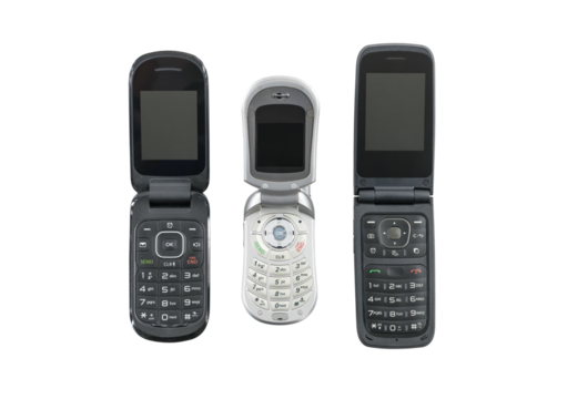 Three old flip cell phones isolated with cut out background.  