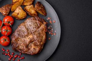 Delicious juicy pork or beef steak grilled with salt, spices and herbs