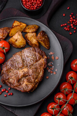 Delicious juicy pork or beef steak grilled with salt, spices and herbs