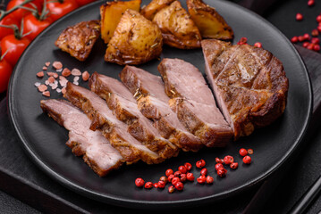 Delicious juicy pork or beef steak grilled with salt, spices and herbs