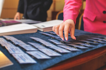 Process of checking in on a conference congress forum event, registration desk table, visitors and...