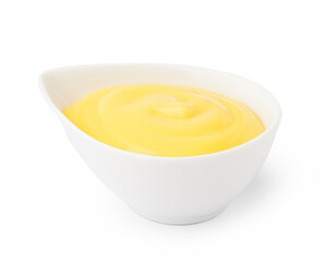 Bowl with tasty cheddar cheese sauce on white background