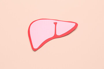 Pink paper liver on beige background