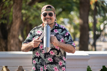Hispanic artist playing güiro in the street