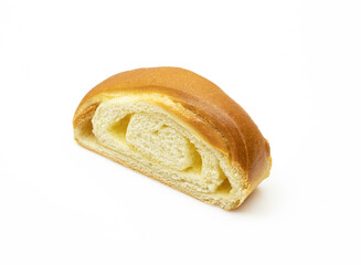 Sliced piece of dessert pastry roll filled with vanilla cream isolated on white background