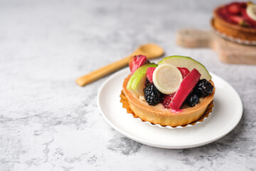 mixed fruit tart on a light table. Delicious bakery and pastry.