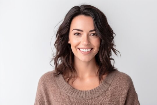 Medium shot portrait photography of a pleased woman in her 30s that is wearing a cozy sweater against a white background 