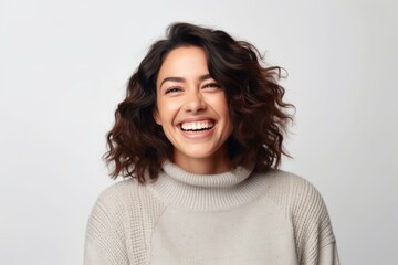 Fototapeta premium Medium shot portrait photography of a grinning woman in her 30s that is wearing a cozy sweater against a white background . Generative AI