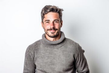 Naklejka premium Portrait of a handsome young man in sweater on a white background