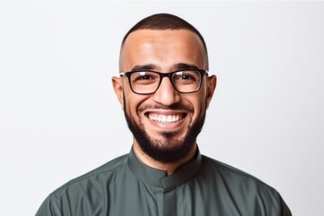 Portrait of a happy young man in eyeglasses over white background