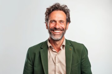 Portrait of a happy mature man smiling at the camera over white background