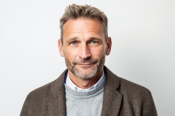 Obraz premium Portrait of a handsome middle-aged man with grey hair wearing a jacket