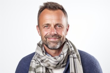 Obraz premium Portrait of smiling man wearing scarf over white background. Looking at camera