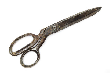 Old and rusty retro dressmaking scissors isoilated on white background. Traditional fashion equipment 