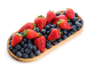 Wooden plate with ripe strawberry and blueberry on white background