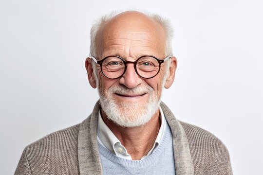 Close-up portrait photography of a cheerful man in his 60s that is wearing a chic cardigan against a white background . Generative AI