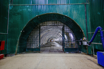 Fototapeta na wymiar Dark large tunnel at old underground bunker