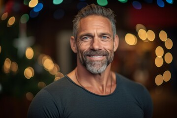 Portrait of a handsome mature man smiling at the camera while standing in a pub