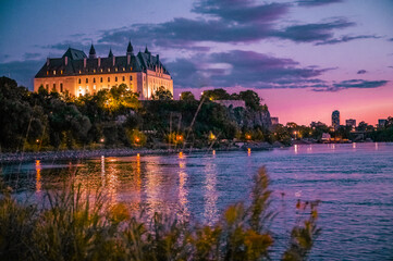 Supreme Court of Canada and the Ottawa River with a colourful sunset sky Ottawa, Ontario, Canada....