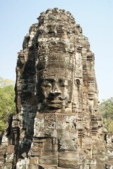 Fototapeta premium Closeup of a face in the stone in the Buddhist Bayon Temple in Siem Reap, Cambodia