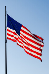 United States of America Stars and Stripes national flag fluttering on pole