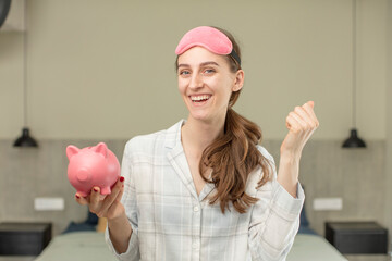 feeling shocked,laughing and celebrating success. piggy bank concept