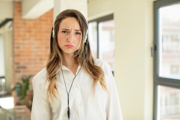 pretty woman feeling sad and whiney with an unhappy look and crying. telemarketer concept