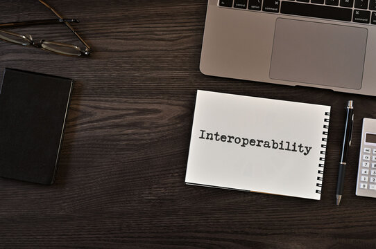 There is notebook with the word Interoperability. It is as an eye-catching image.