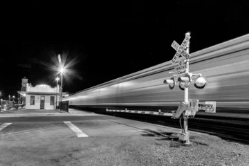 Fototapete Route 66 Railroad crossing by night with sign  © travelview