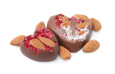 Tasty chocolate heart shaped candies with nuts on white background
