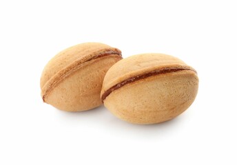 Delicious nut shaped cookies with boiled condensed milk on white background